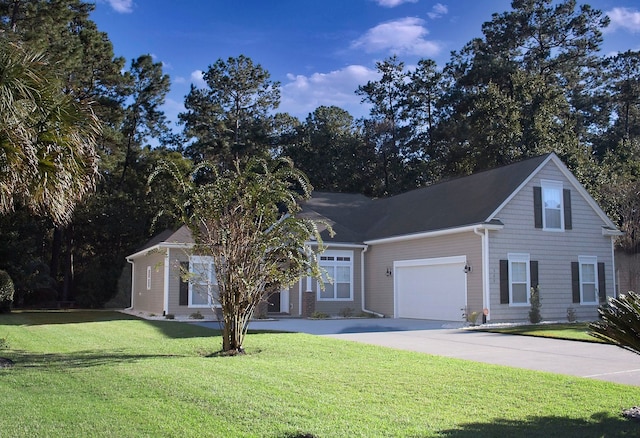 view of front of house featuring a garage and a front yard