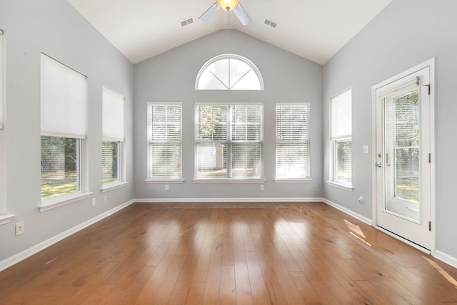 unfurnished sunroom featuring ceiling fan and lofted ceiling