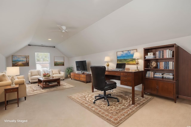 office with vaulted ceiling, ceiling fan, and carpet floors