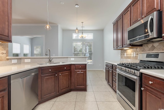 kitchen featuring backsplash, appliances with stainless steel finishes, light tile patterned floors, and a sink