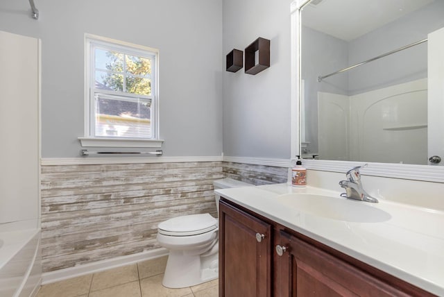 full bathroom featuring wood walls, tile patterned flooring, vanity, shower / washtub combination, and toilet