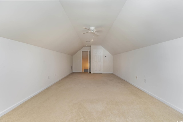 bonus room featuring light colored carpet, baseboards, and lofted ceiling