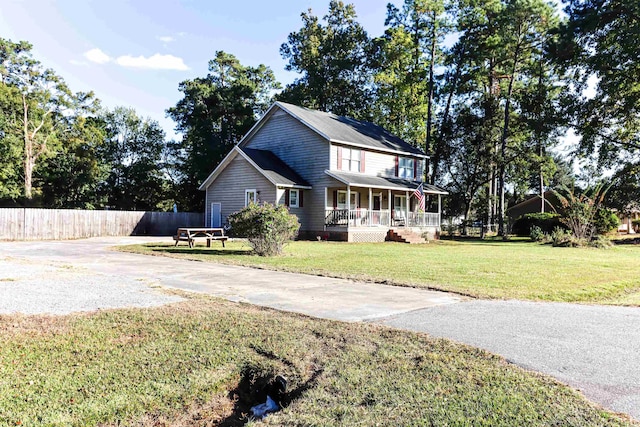 view of front of house featuring a front lawn and a porch