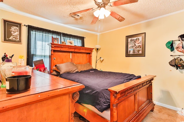 carpeted bedroom with a textured ceiling, ceiling fan, and crown molding