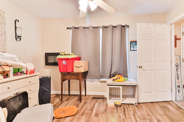 playroom featuring ceiling fan and light wood-type flooring