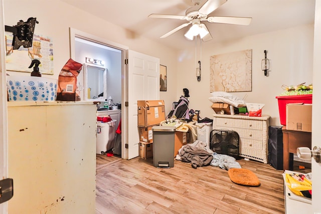 misc room with ceiling fan and light hardwood / wood-style flooring