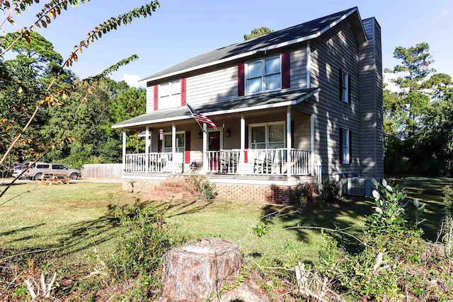 view of front facade featuring a front yard, a porch, and central air condition unit