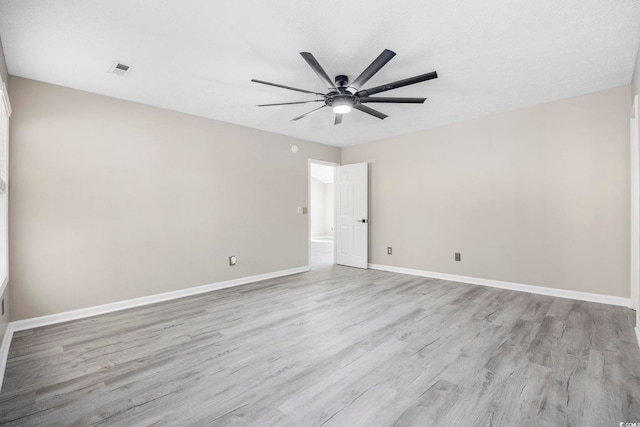 unfurnished room with ceiling fan and light hardwood / wood-style flooring