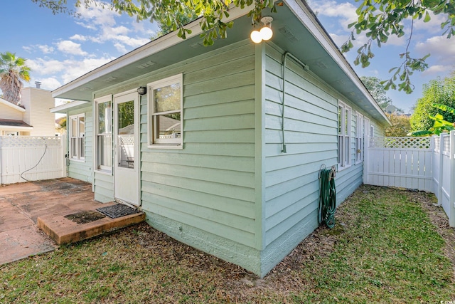 view of side of home featuring a patio area