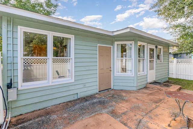 entrance to property featuring a patio