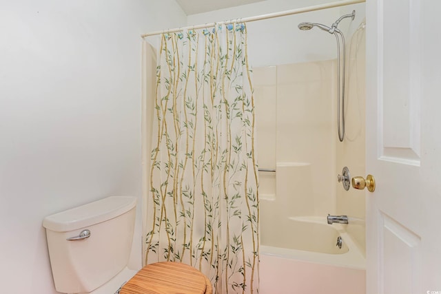 bathroom with toilet and shower / tub combo