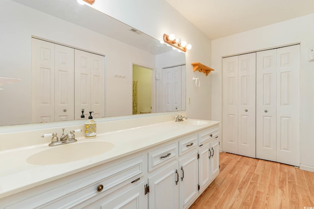 bathroom featuring vanity and hardwood / wood-style floors