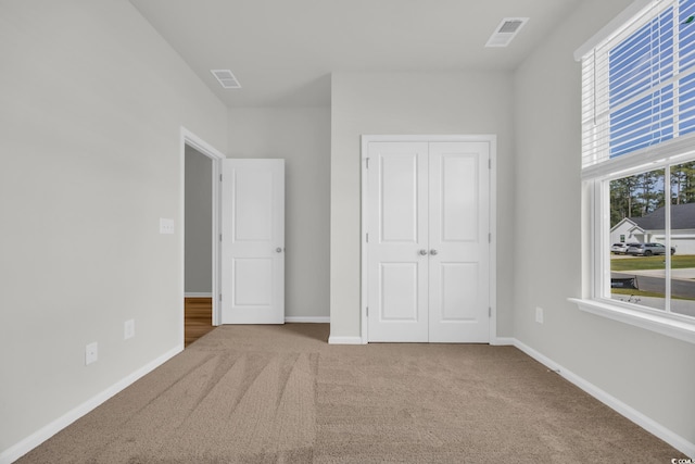 389 Sun Colony Blvd, Longs, SC 29568 - unfurnished bedroom with carpet and a closet