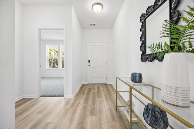 corridor featuring light hardwood / wood-style flooring