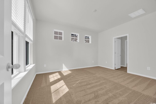 389 Sun Colony Blvd, Longs, SC 29568 - unfurnished room featuring healthy amount of natural light and carpet flooring