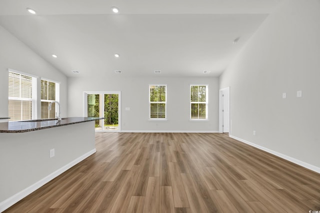 389 Sun Colony Blvd, Longs, SC 29568 - unfurnished living room featuring light wood-style floors, recessed lighting, and lofted ceiling