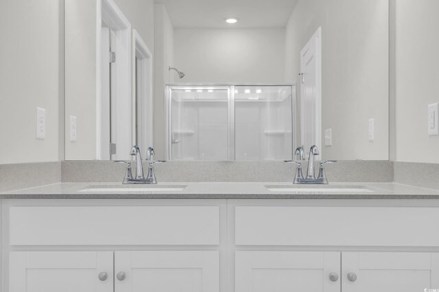 389 Sun Colony Blvd, Longs, SC 29568 - full bathroom with double vanity, a shower with door, and recessed lighting