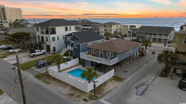 aerial view at dusk with a water view