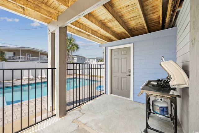 view of patio / terrace with a fenced in pool