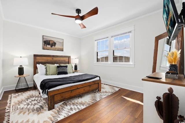 bedroom featuring ceiling fan, crown molding, and dark hardwood / wood-style floors