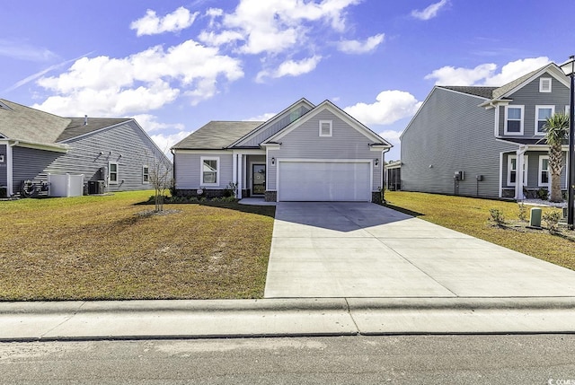 view of front of house with a front yard, a garage, and cooling unit