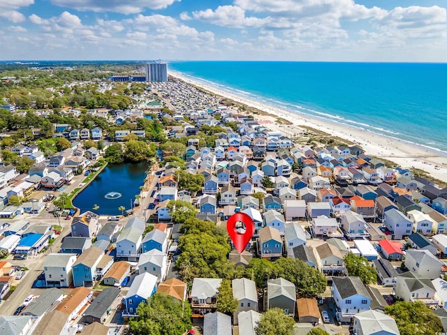 aerial view featuring a water view and a beach view