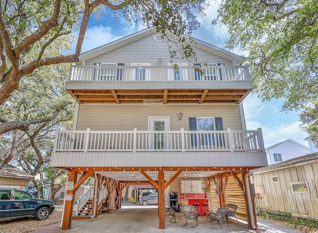 exterior space featuring a balcony and a carport