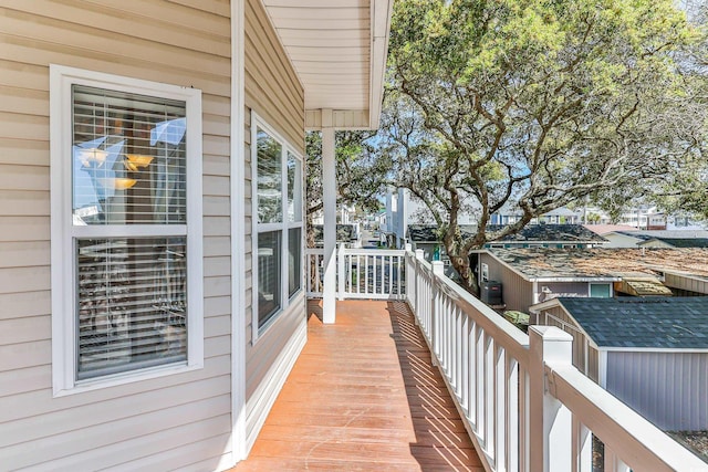 wooden balcony featuring a deck