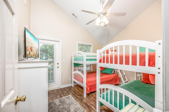 bedroom featuring dark wood-type flooring, high vaulted ceiling, and ceiling fan