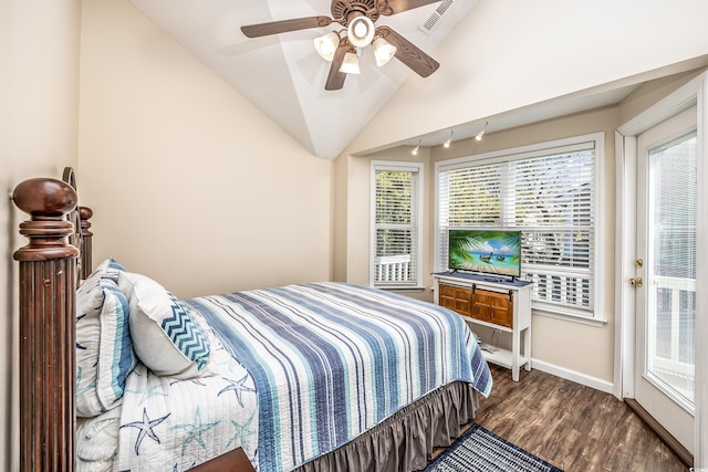 bedroom with dark wood-type flooring, vaulted ceiling, and ceiling fan