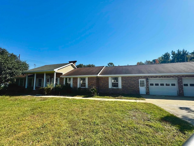 single story home featuring a front yard and a garage