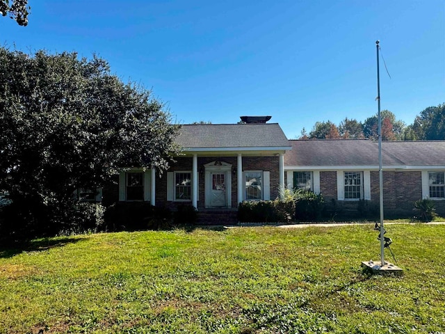 view of front of home with a front yard