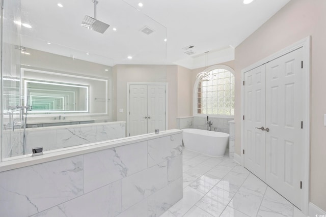 bathroom featuring a tub to relax in