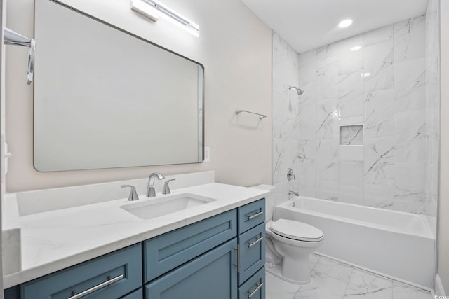 full bathroom with toilet, tiled shower / bath, and vanity