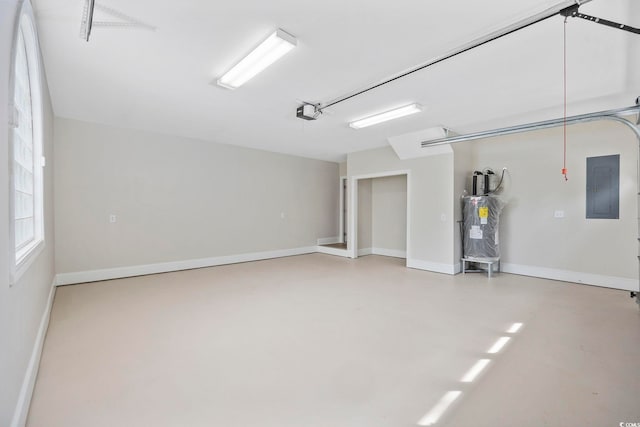 garage with a garage door opener, water heater, and electric panel