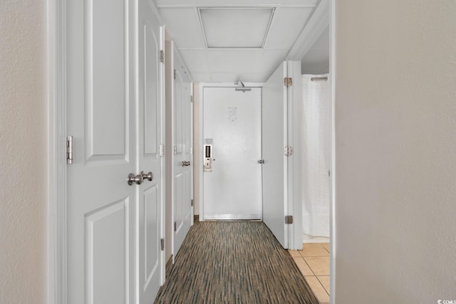 hallway featuring tile patterned floors