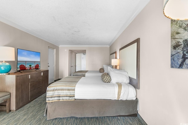 bedroom featuring ornamental molding, a textured ceiling, and light colored carpet