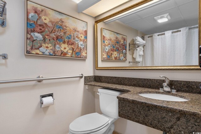 bathroom featuring toilet and sink