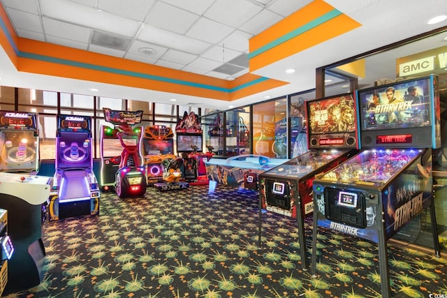 playroom featuring a drop ceiling and carpet floors