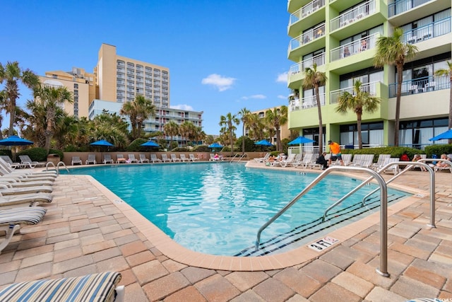 view of swimming pool with a patio area