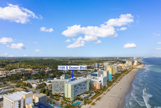 bird's eye view with a water view and a view of the beach