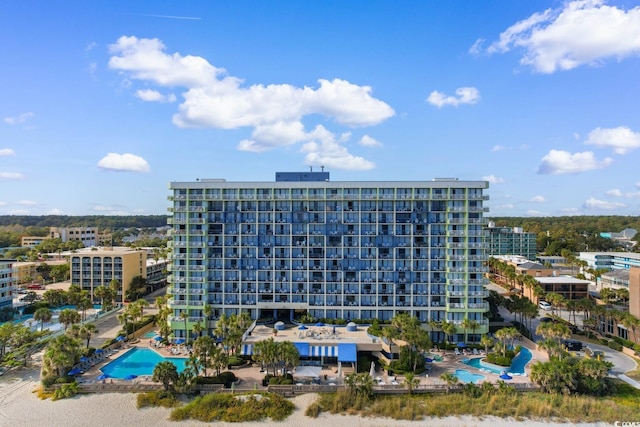 view of property featuring a community pool