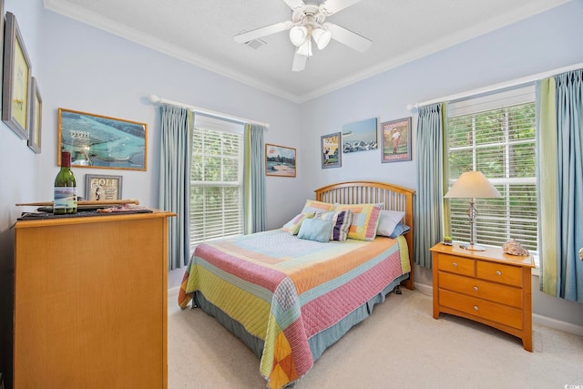 bedroom with crown molding, ceiling fan, and light carpet