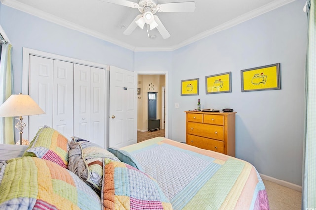 bedroom featuring crown molding, ceiling fan, light carpet, and a closet