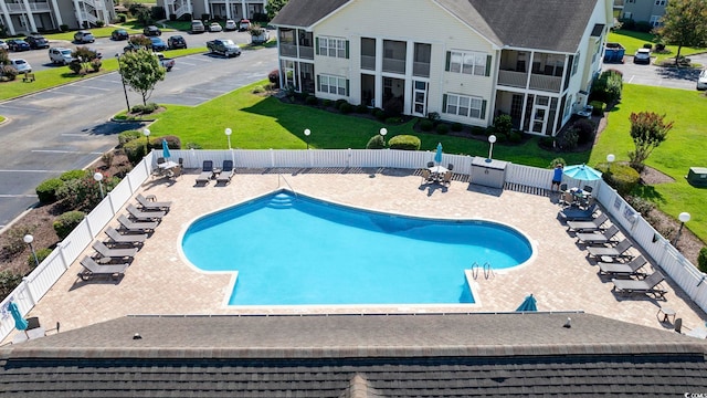 view of swimming pool featuring a patio area