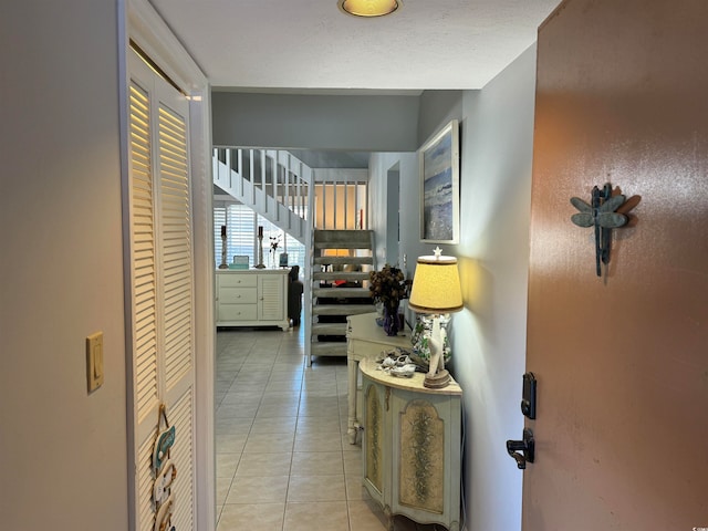 corridor featuring light tile patterned floors