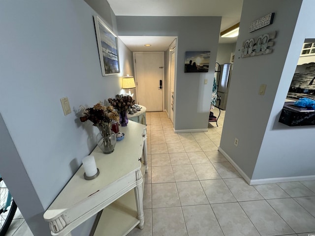 hallway featuring light tile patterned floors