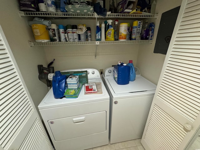 laundry area with light tile patterned flooring and independent washer and dryer