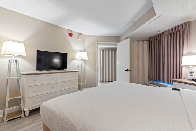 bedroom with light wood-type flooring