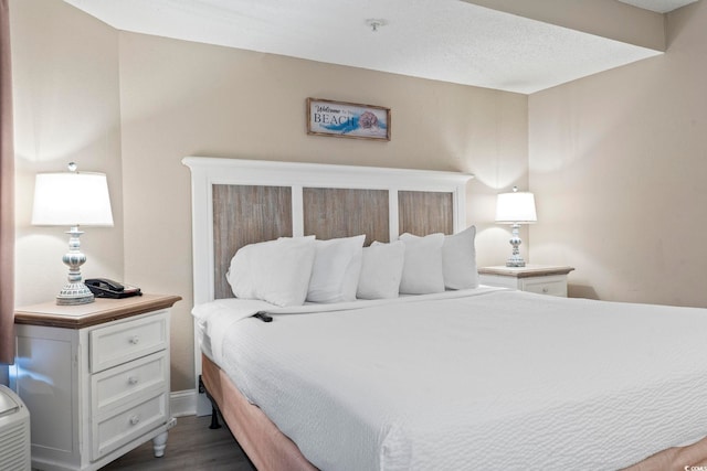 bedroom featuring dark hardwood / wood-style floors